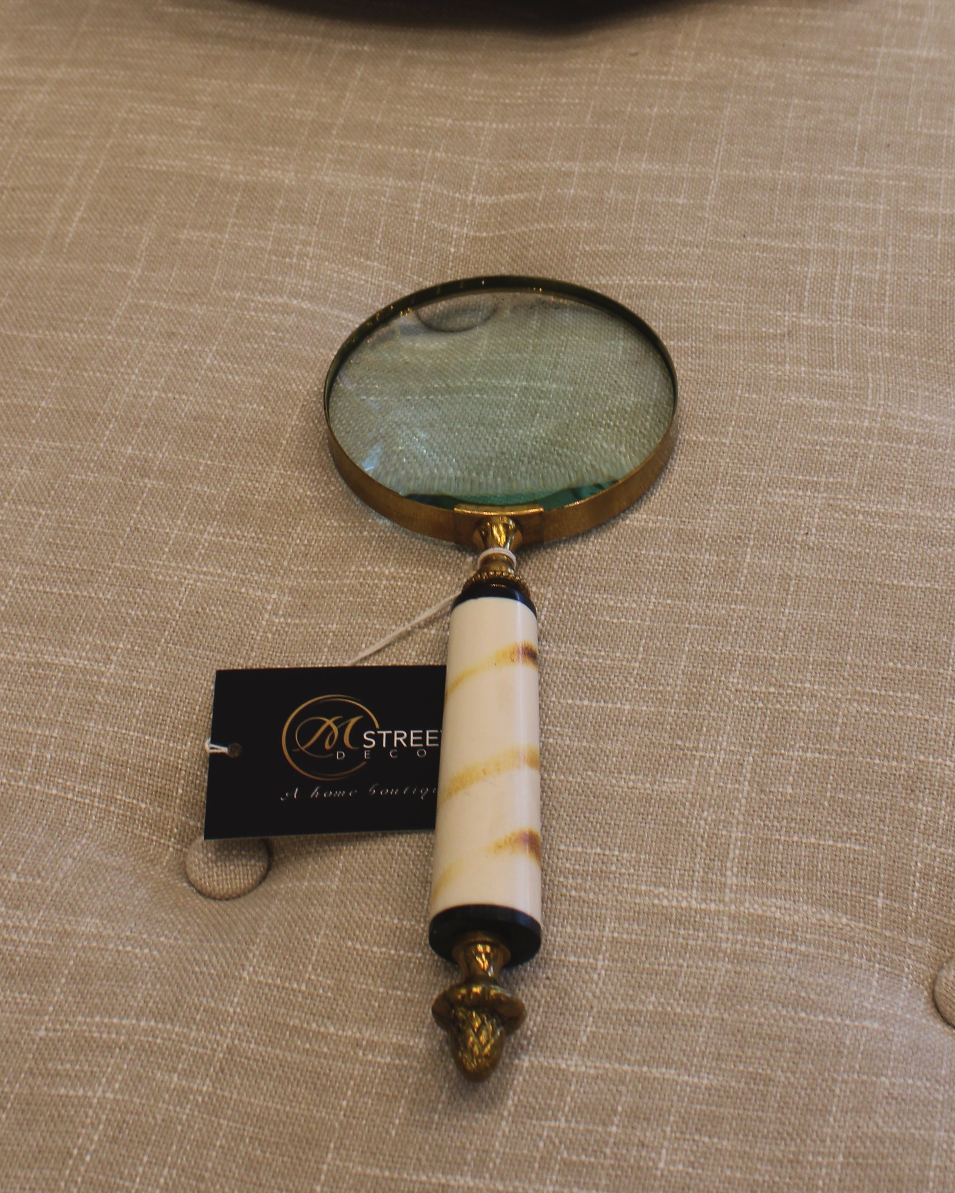 White and Gold Magnifying Glasses